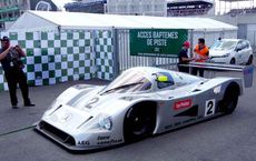 "White diesel-powered race car on a track, illustrating efficiency and performance, on digipdemo.com article about diesel benefits."
