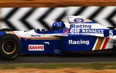 Blue and white racing car speeding on track, featured on digipdemo.com in an article about Damon Hill.