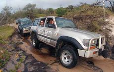 "Off-road vehicles navigating muddy tracks on Fraser Island, featured on digipdemo.com"