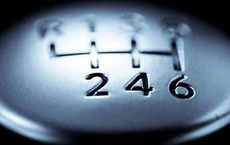 Close-up of a manual transmission gear shift highlighting gears 2, 4, and 6 for an article on digipdemo.com.