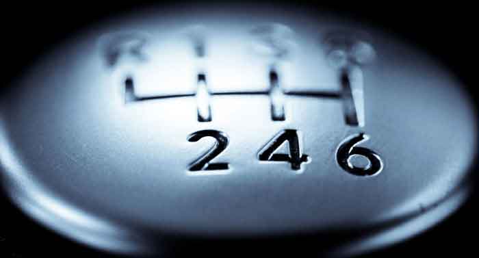 Close-up of a manual transmission gear shift highlighting gears 2, 4, and 6 for an article on digipdemo.com.