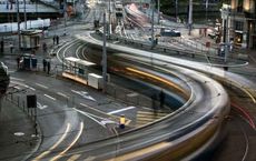 Busy intersection with light trails from cars, showcasing the mobility of private vehicles for digipdemo.com article.